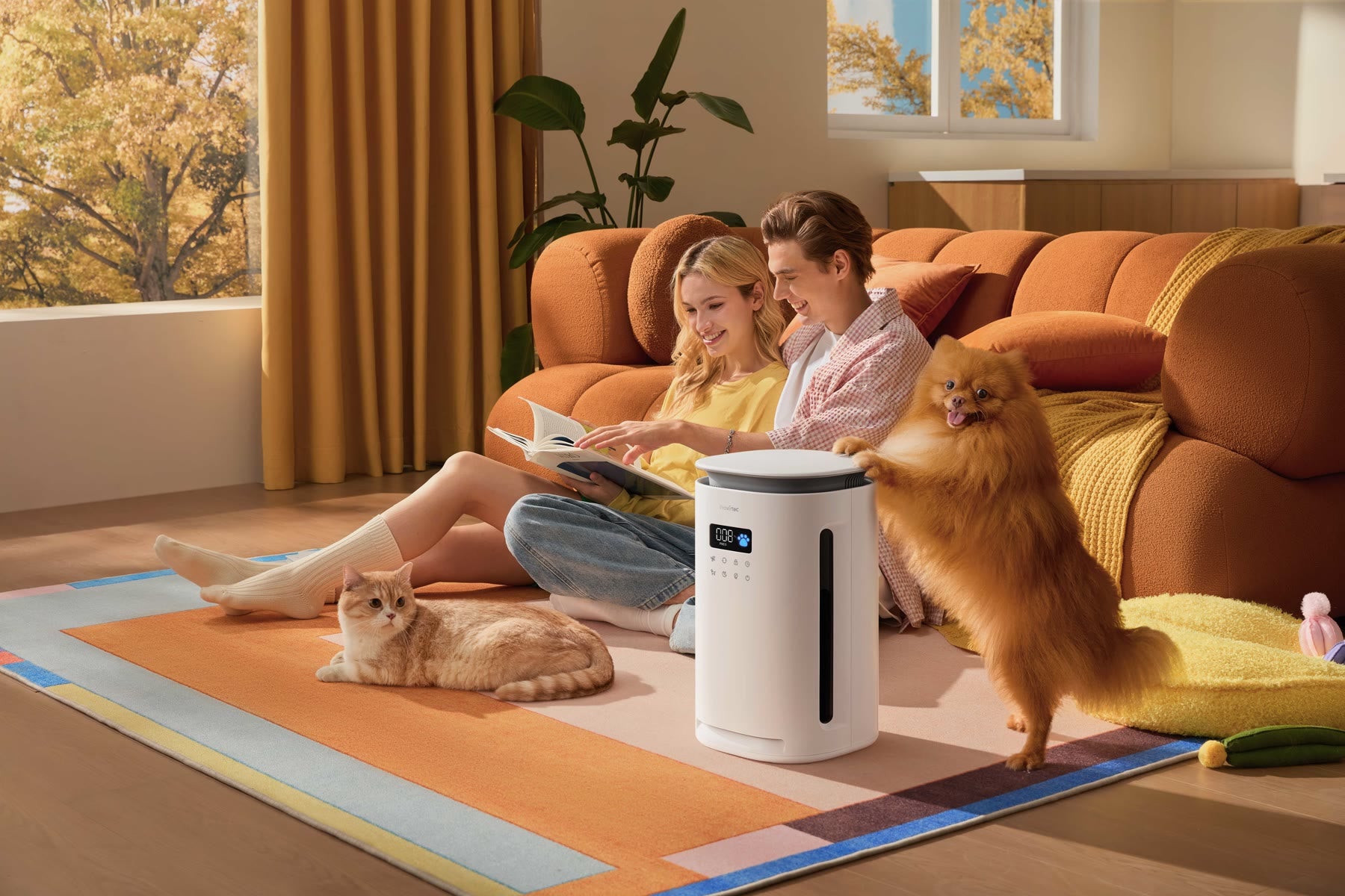 Pawtent with a couple, dog and cat in a living room